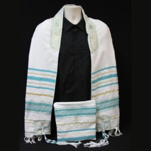 The One new Man Cyrus Tallit modeled on a mannequin with the matching storage bag in front of it.