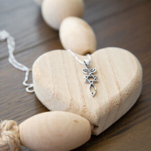 clm onm pendant on wooden heart